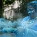 A volunteer sprays a bottle of blue powder at runners during the Ypsilanti Color Run on Saturday, May 11. Daniel Brenner I AnnArbor.com